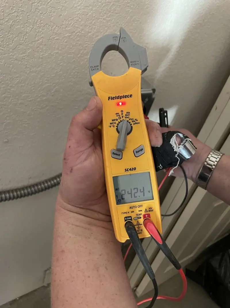 Voltage testing with clamp meter during Generator Installation in River Ridge